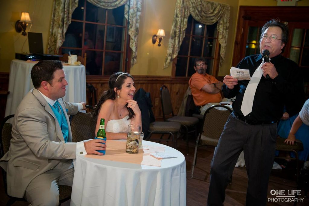 The Bride and Groom enjoy a thought from one of their guests.