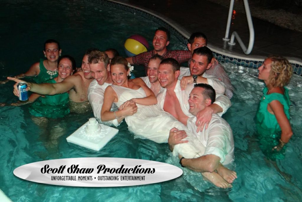 The wedding party in the pool after the wedding reception