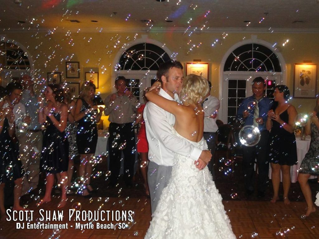 The last dance of the wedding reception with bubbles filling the air