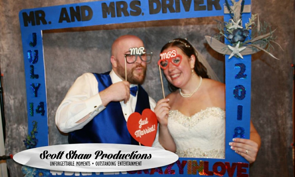 The Bride And Groom In The Photo Booth