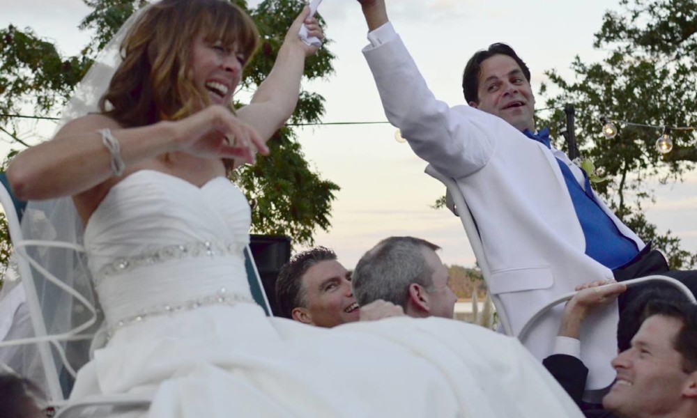 Dancing The Hora Up above the heads of the guests in the chairs with the Hora
