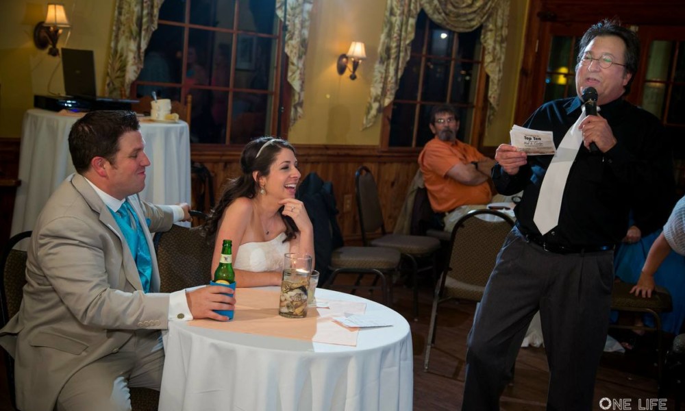 Presenting The Wedding Top Ten List The Bride and Groom enjoy a thought from one of their guests.